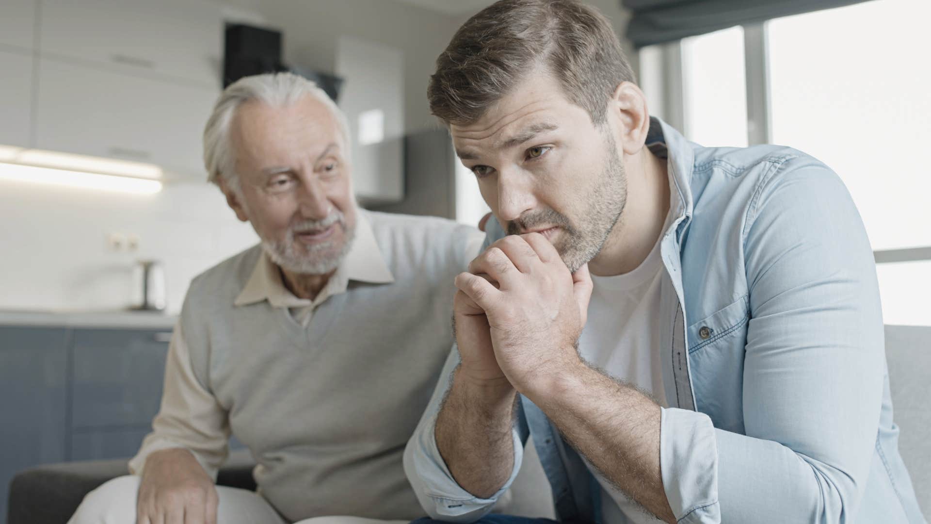 defensive adult man asking dad why should i apologize