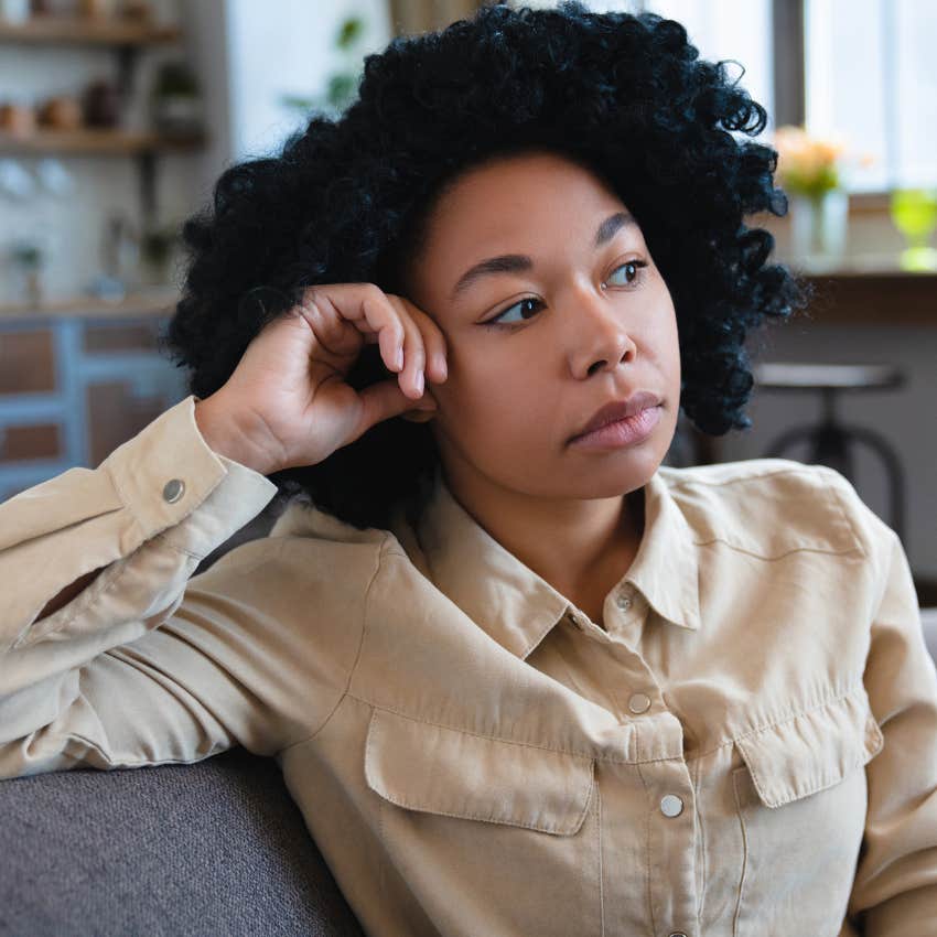 Woman who is lonelier than her parents realize and whose calendar is bare sitting alone at home
