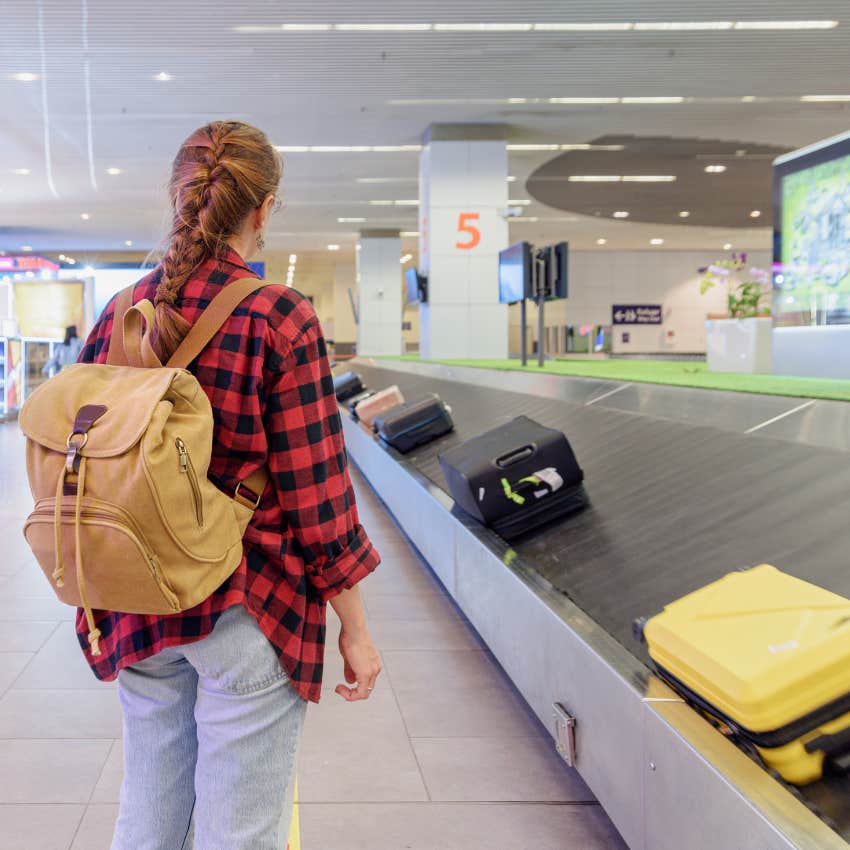 woman in Miami airport waiting for luggage which is likely lost