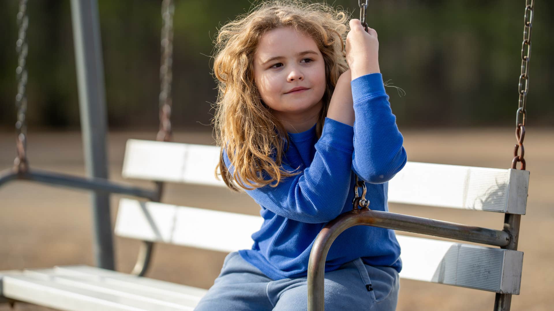 Little girl deciding right and wrong for themselves outside.