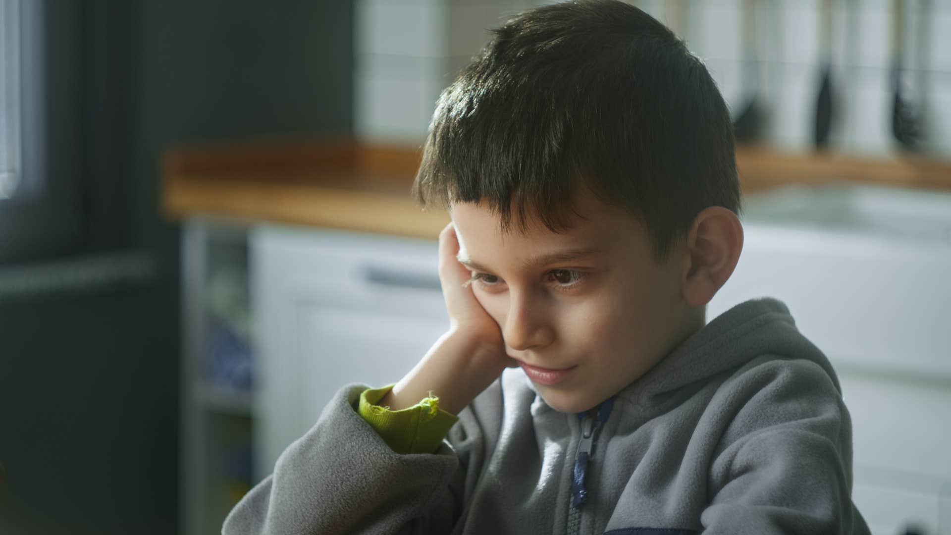 Little boy learning delayed gratification at home