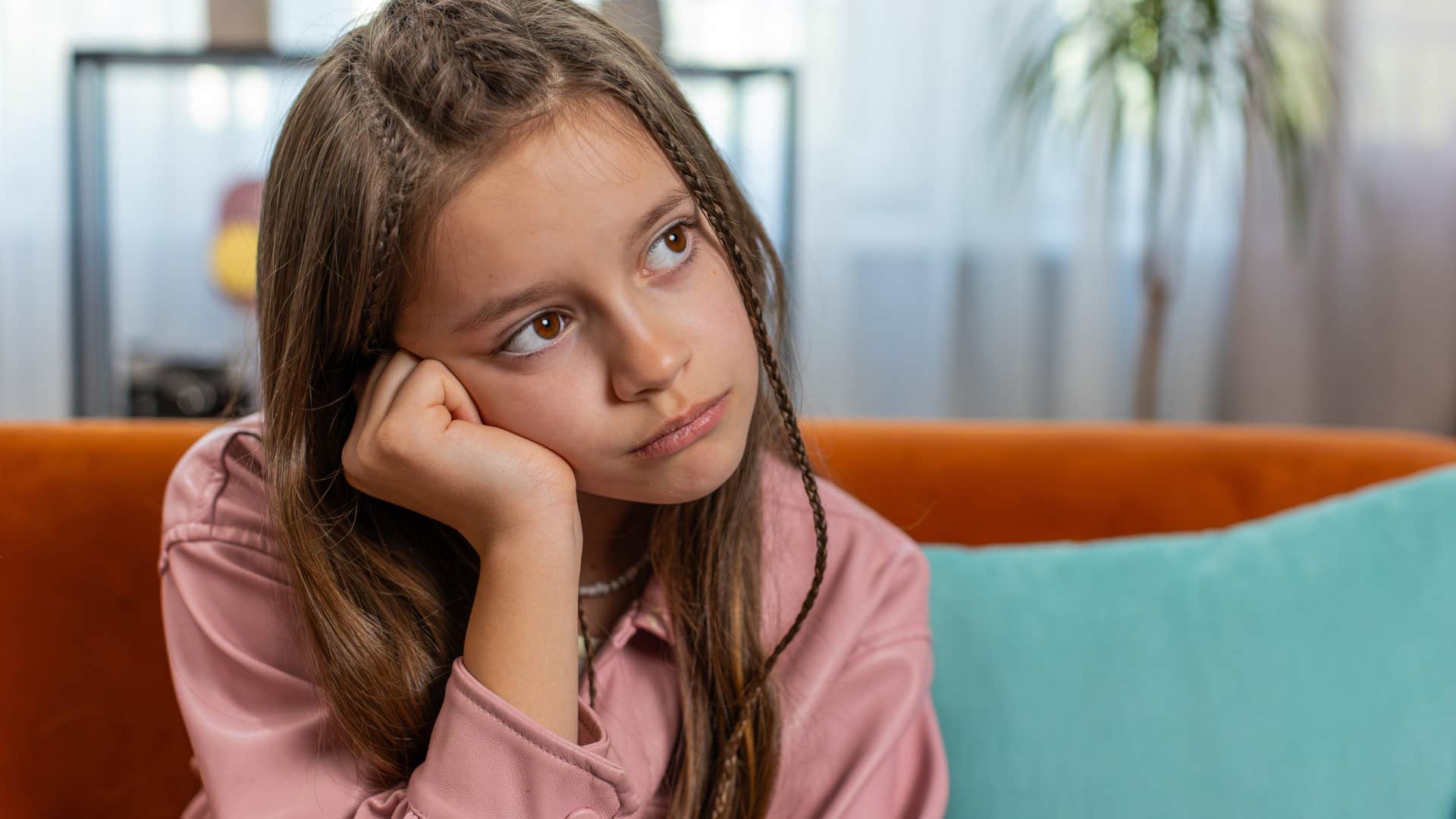 Little girl practicing patience at home alone