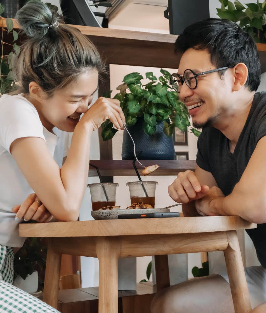 Happy couple laugh on fun date