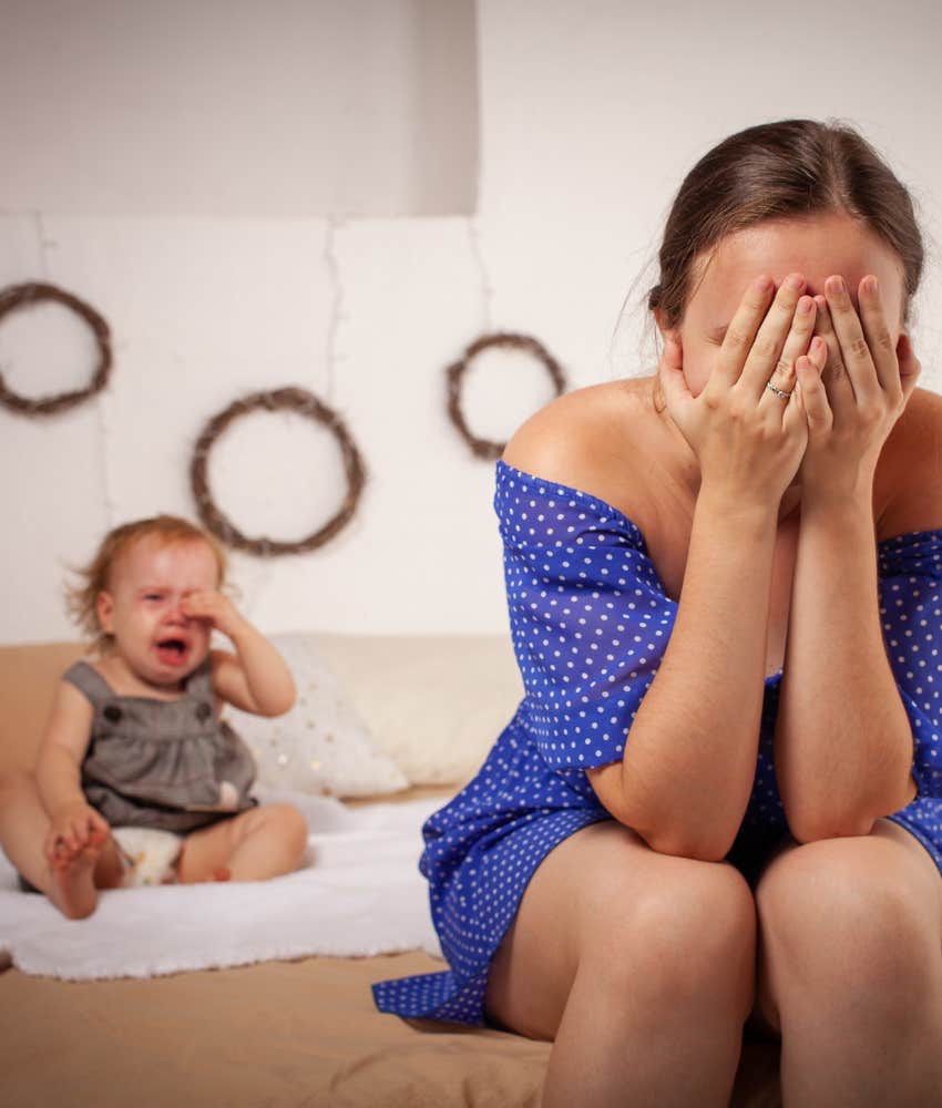 Crying baby with struggling parent