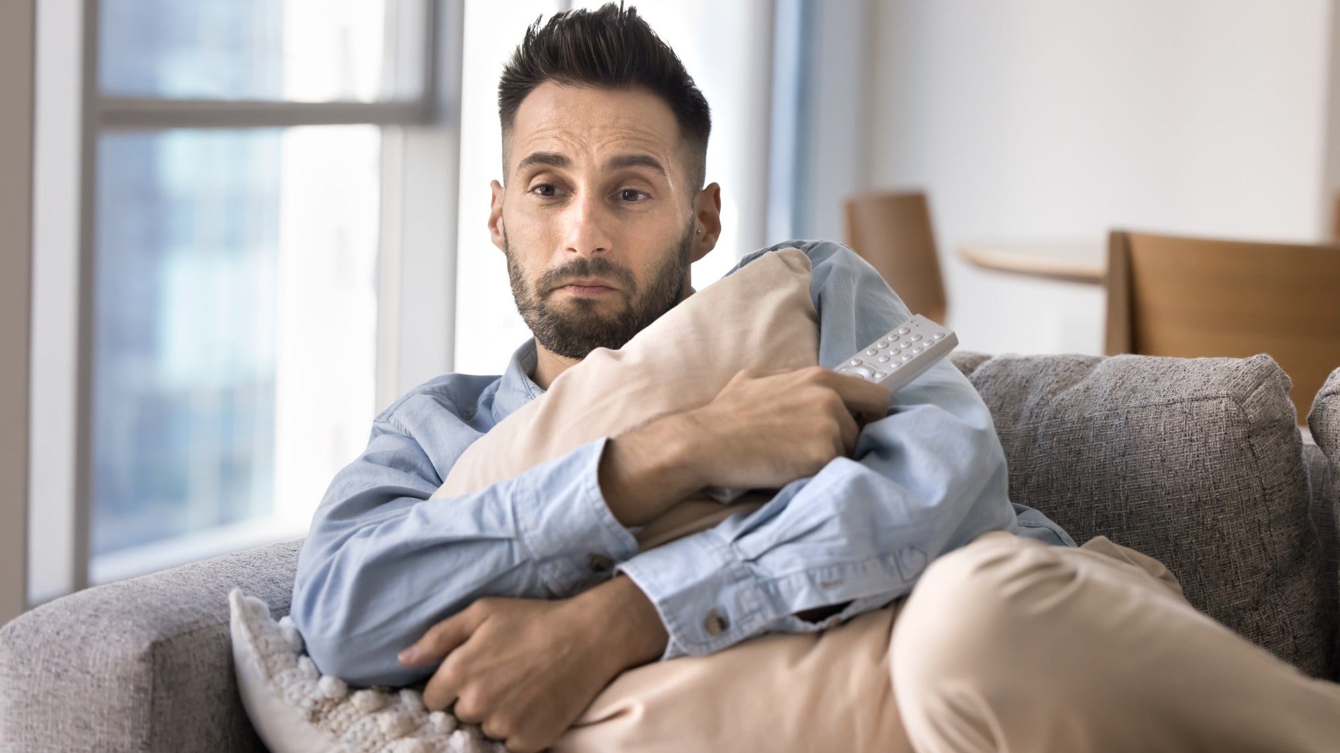 man who feels drained by his relationship spending more time alone