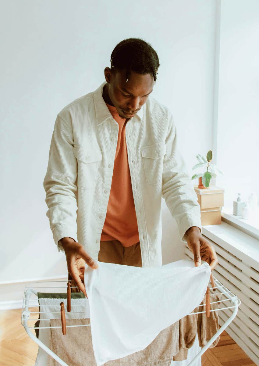 man helping with laundry