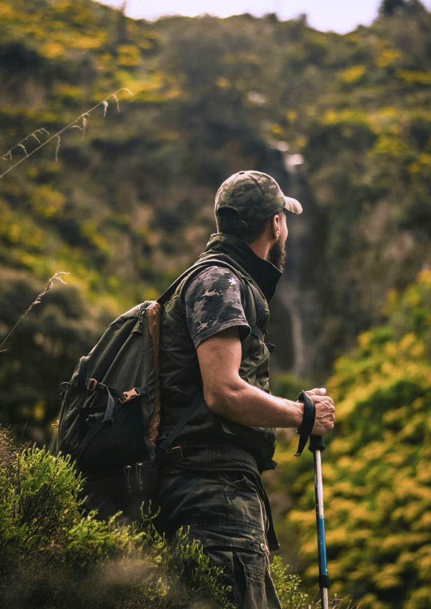man hiking in nature alone