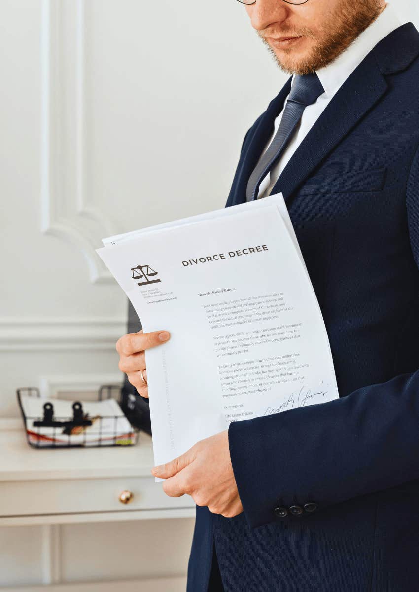 man holding a stack of divorce papers