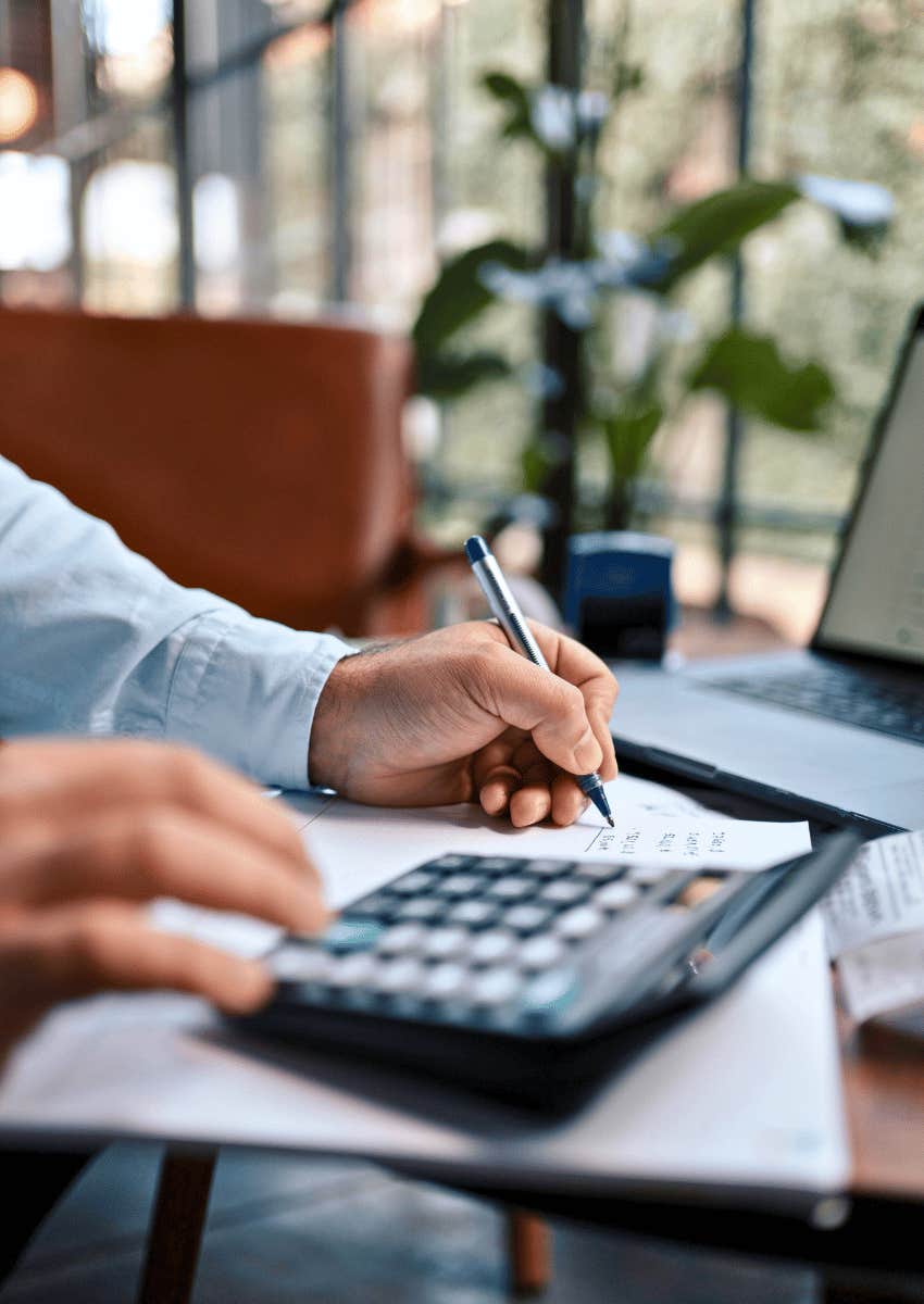 man using a calculator