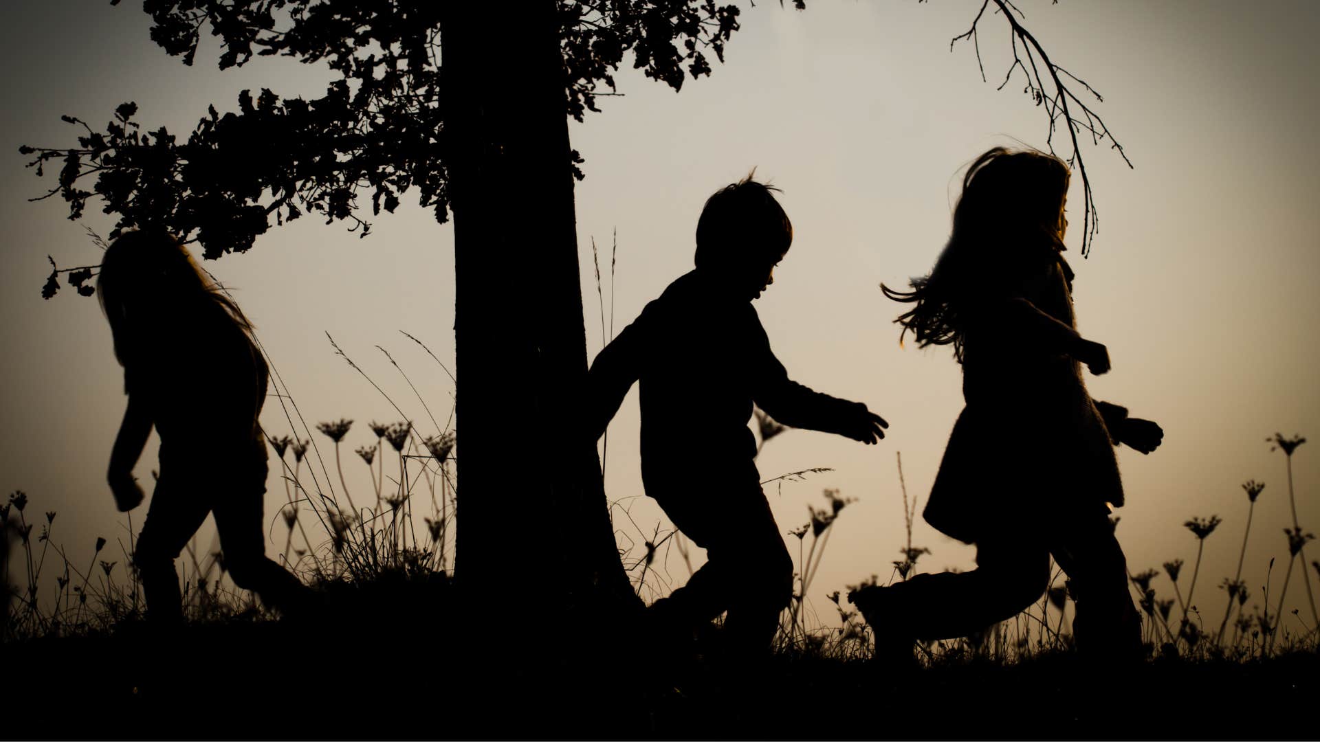 Silhouette image of three children playing showing reason to marry wrong man