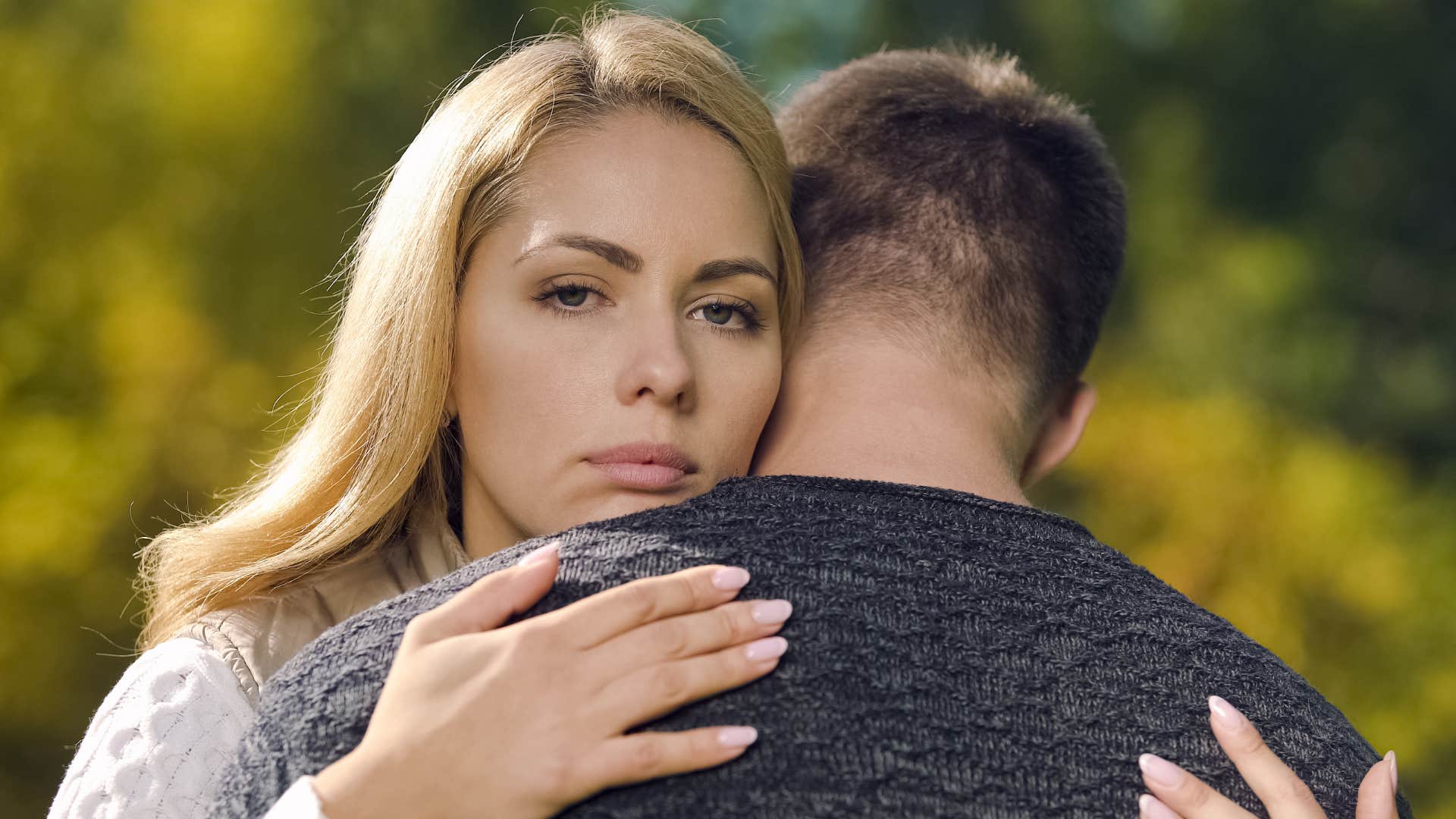 Upset couple hug showing marriage wasn't meant to be
