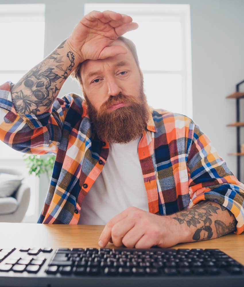 Frustrated man and keyboard showing life and commitment issues