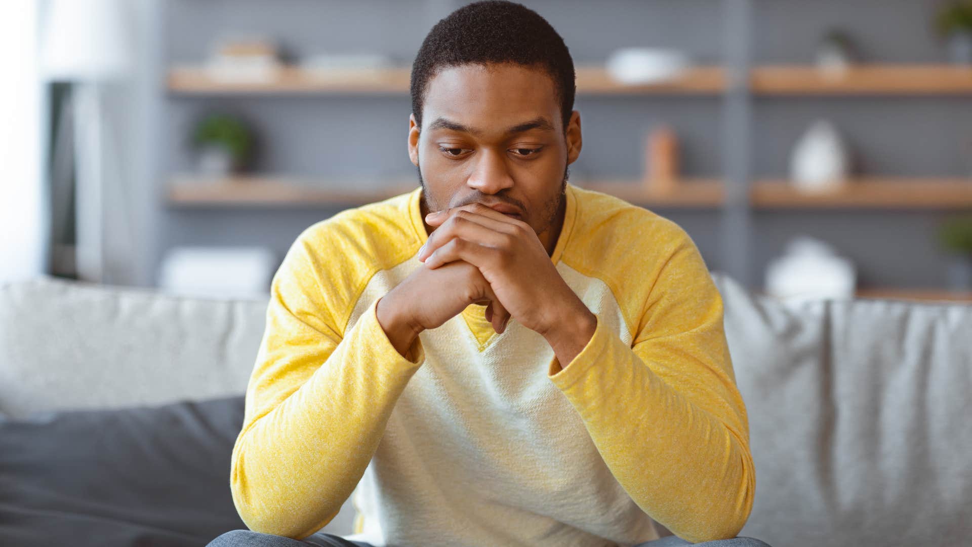 man who clings to traditionally masculine norms looking stressed