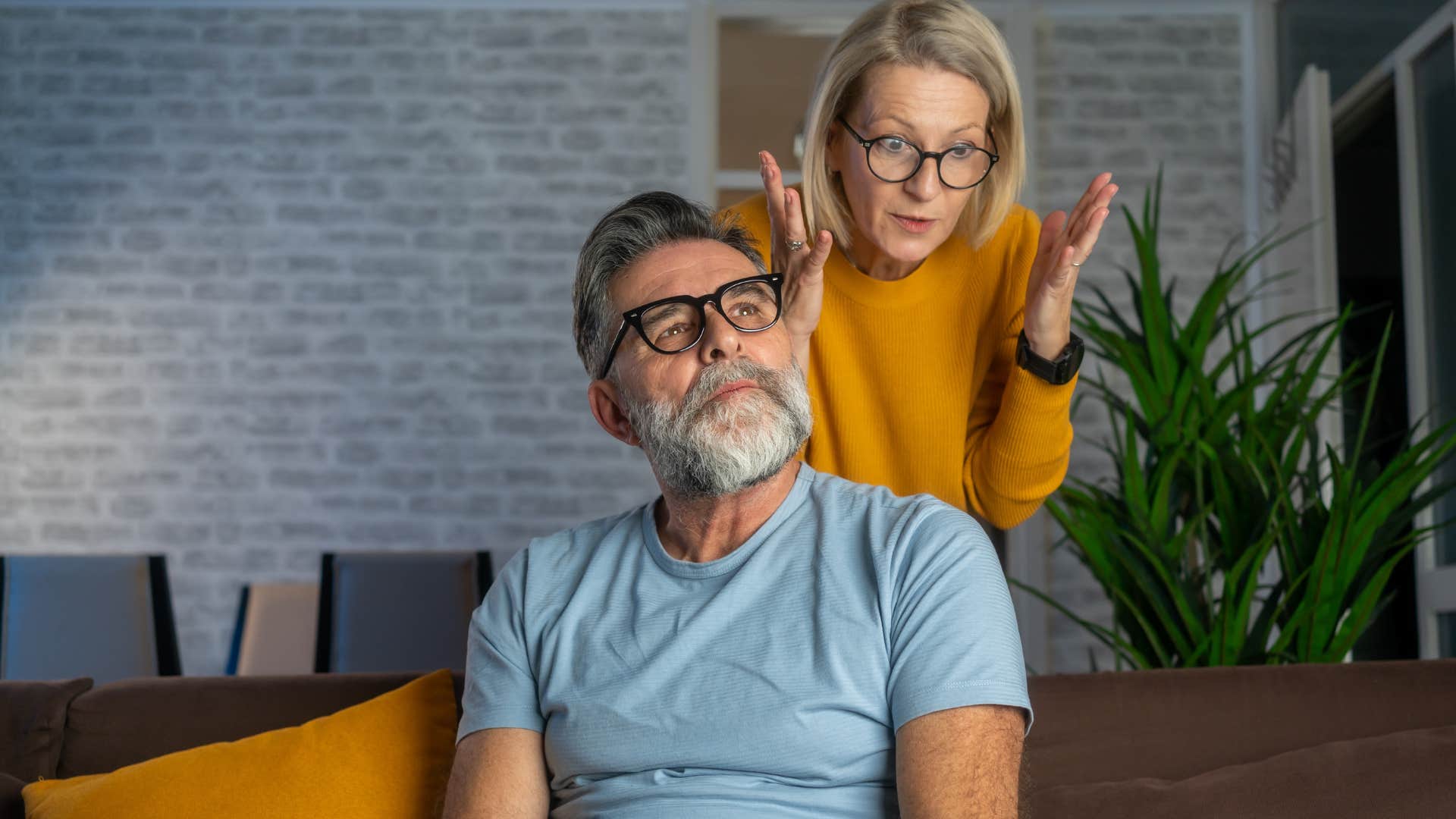 overly sarcastic man arguing with his concerned wife