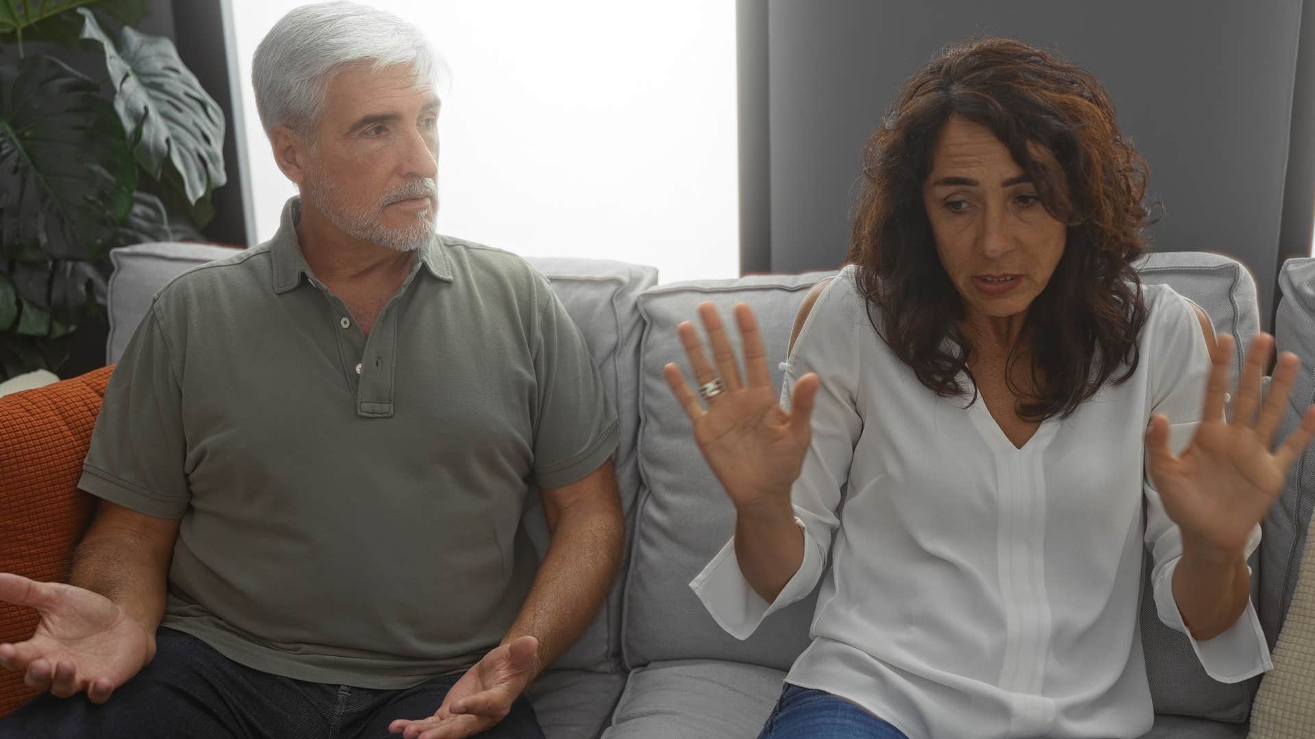 Man who has poor coping mechanisms talking to his upset partner.