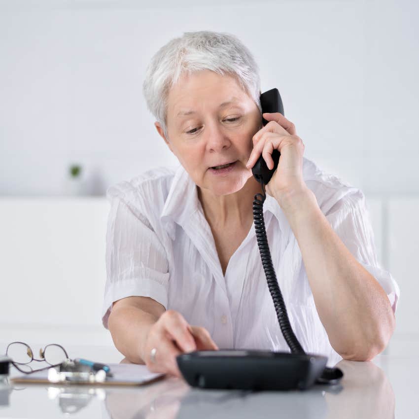 boomer new hire talking on a landline to millennial boss because she doesn't have a cell phone