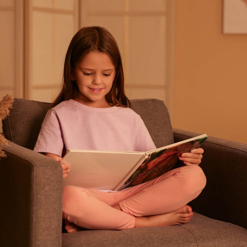 thriving young girl reading hour before bed