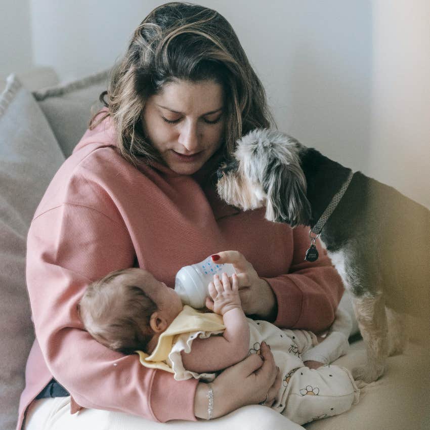 mom with her dog and her new baby