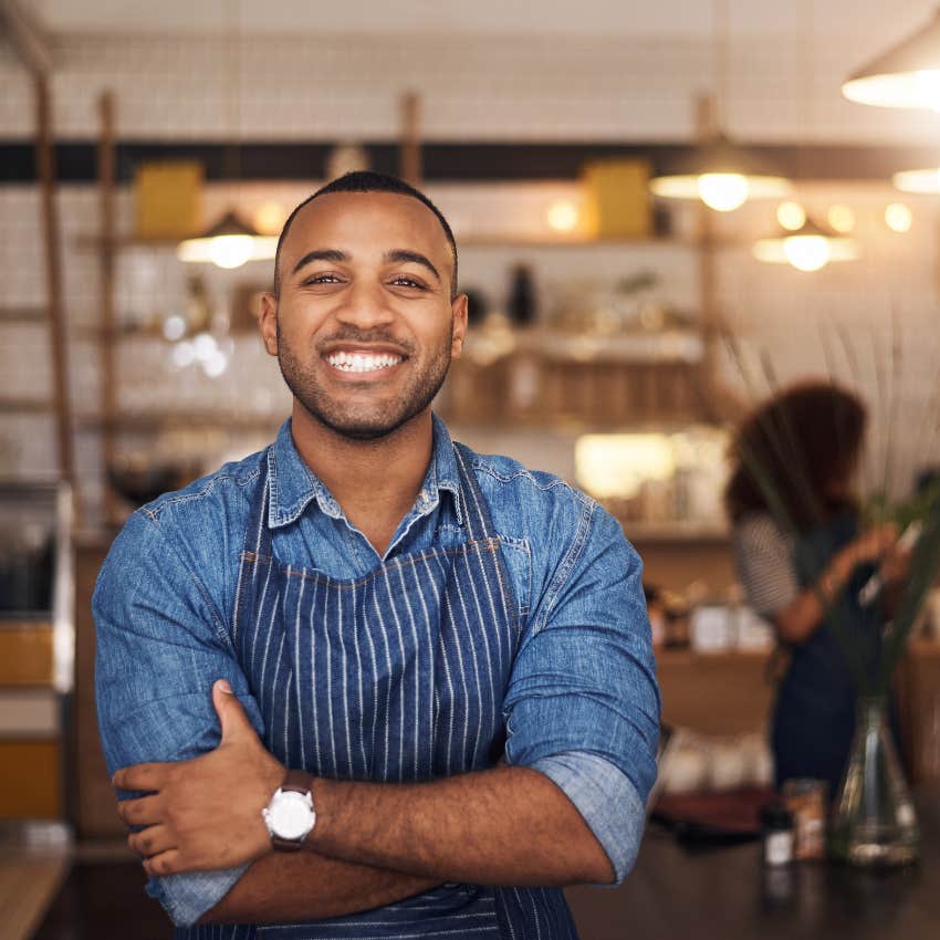 man in place of business thinking like an owner