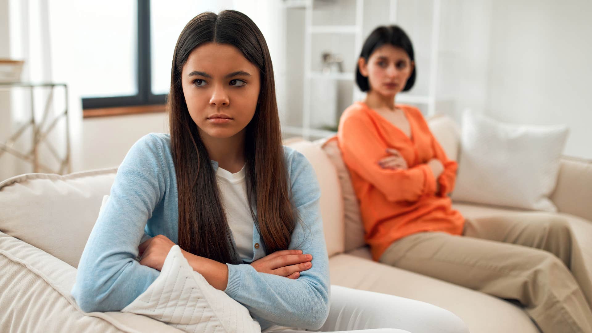 upset daughter turned away from narcissistic mom gaslighting her