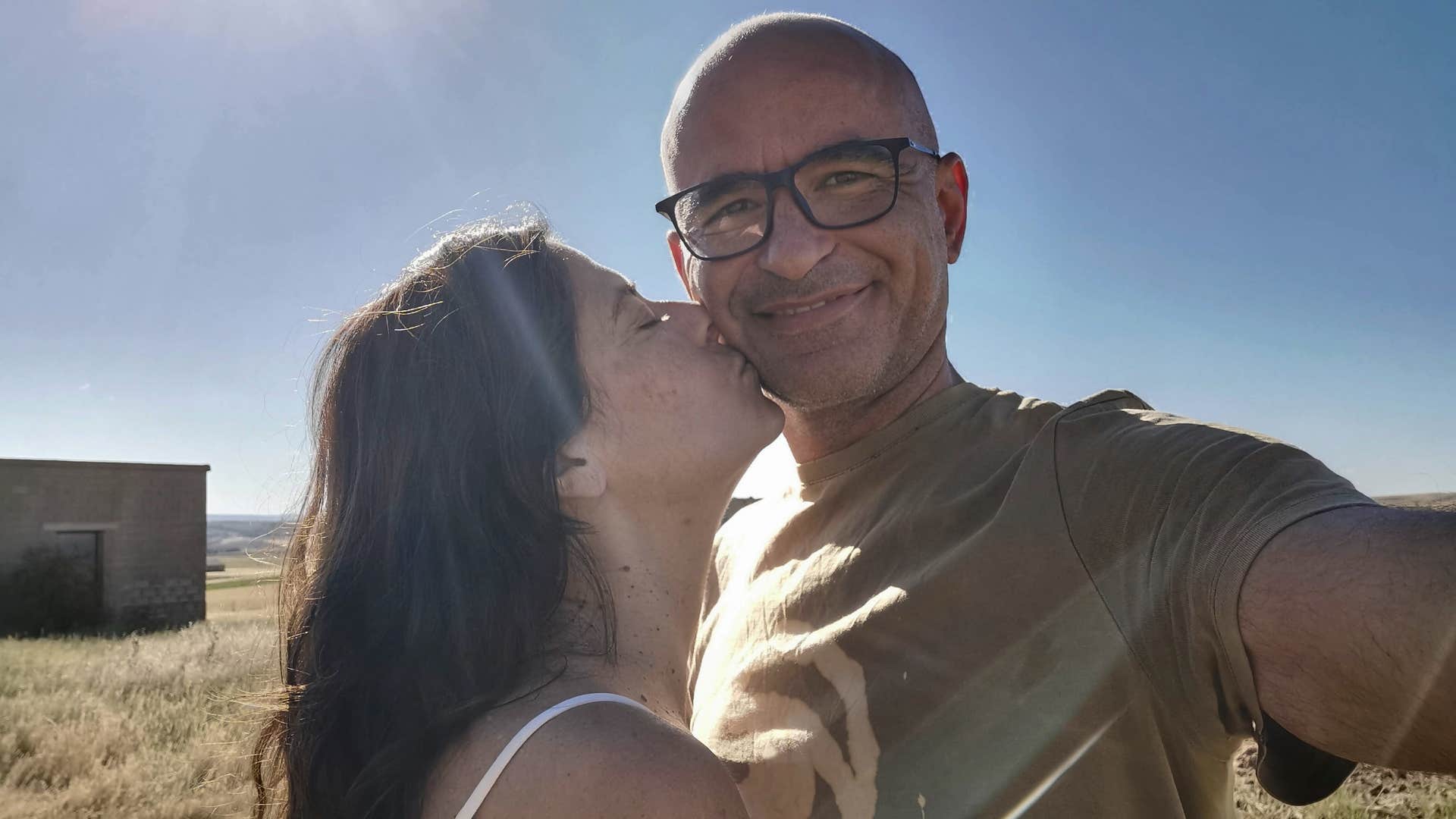 Happy person compliments partner with a kiss showing way to be captivating