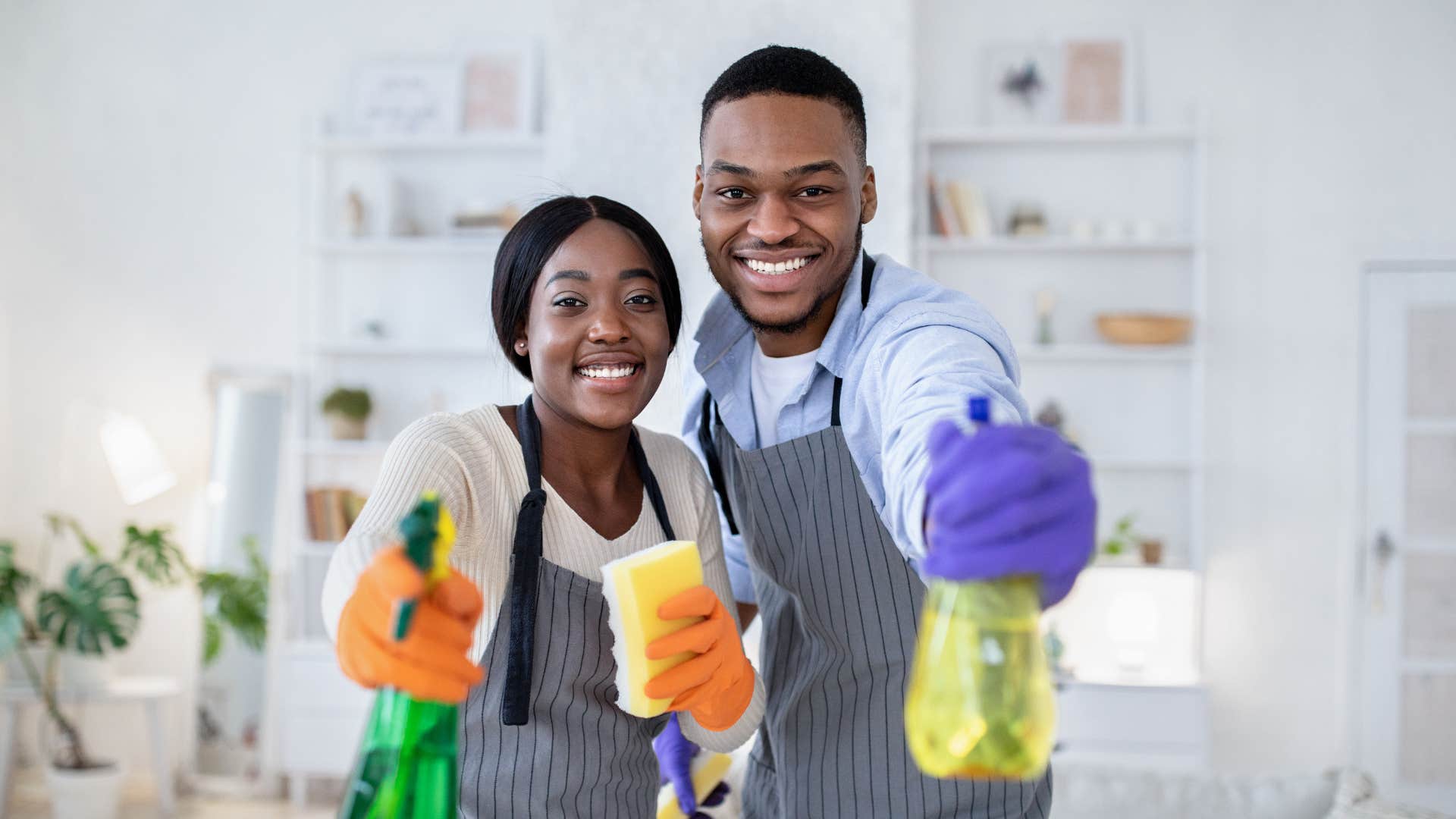 Happy married couple do housework together