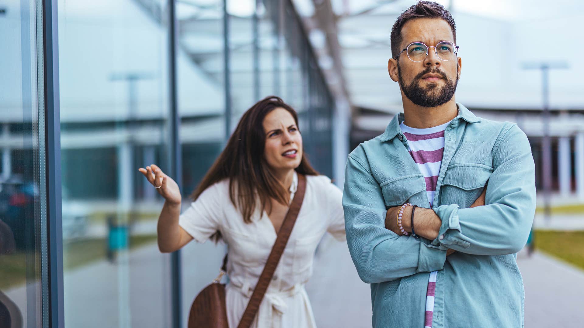 woman trying to talk to sad man who minimizes his own needs and emotions