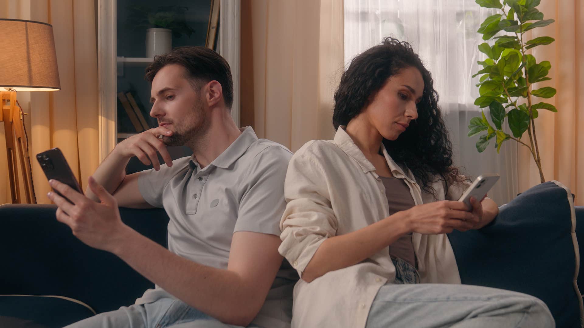 bored couple scrolling on their phones as a distraction