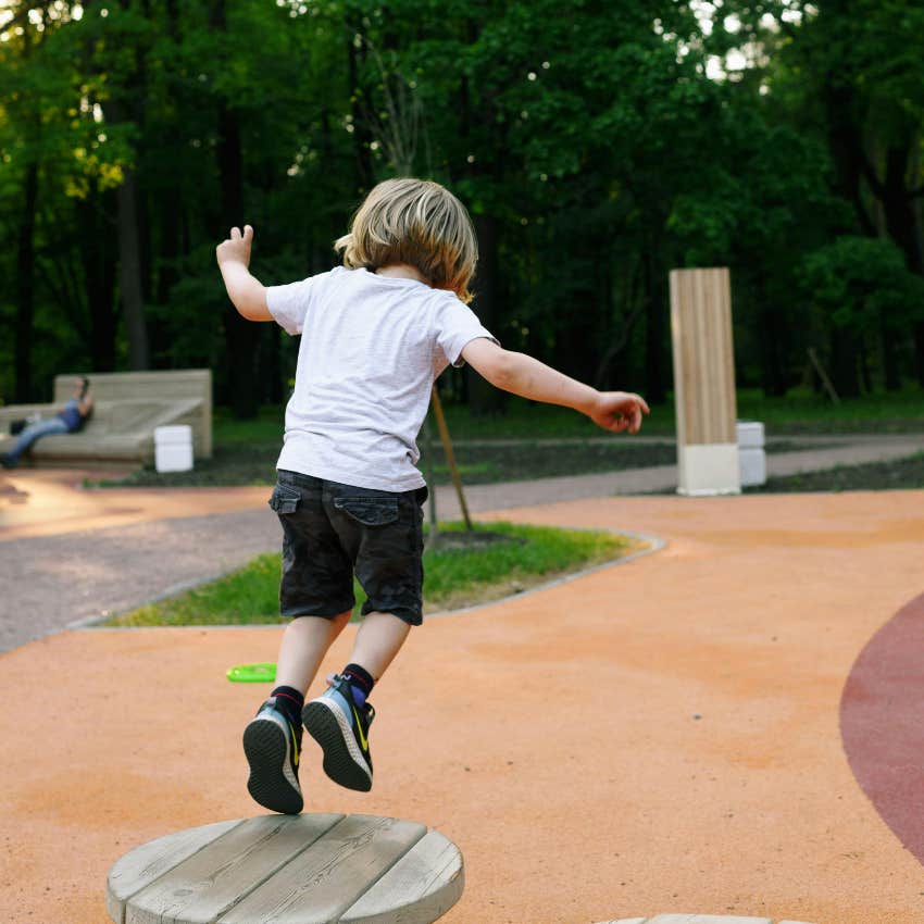boy playing outside developing his vestibular sense