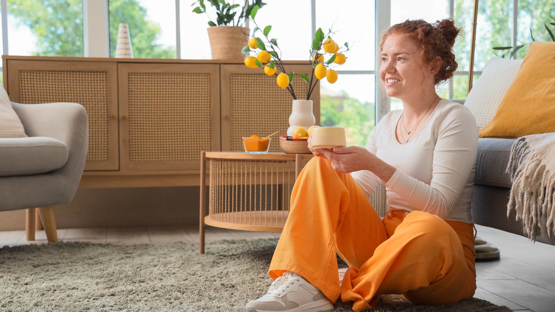 woman sitting on shag carpet in 1970s style living room