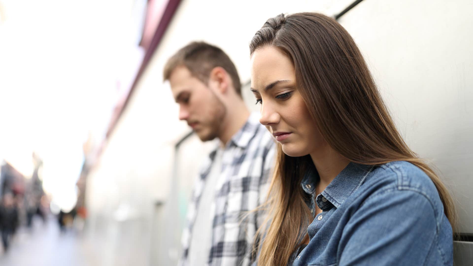 Sad couple don;t look at each other showing brief breakup