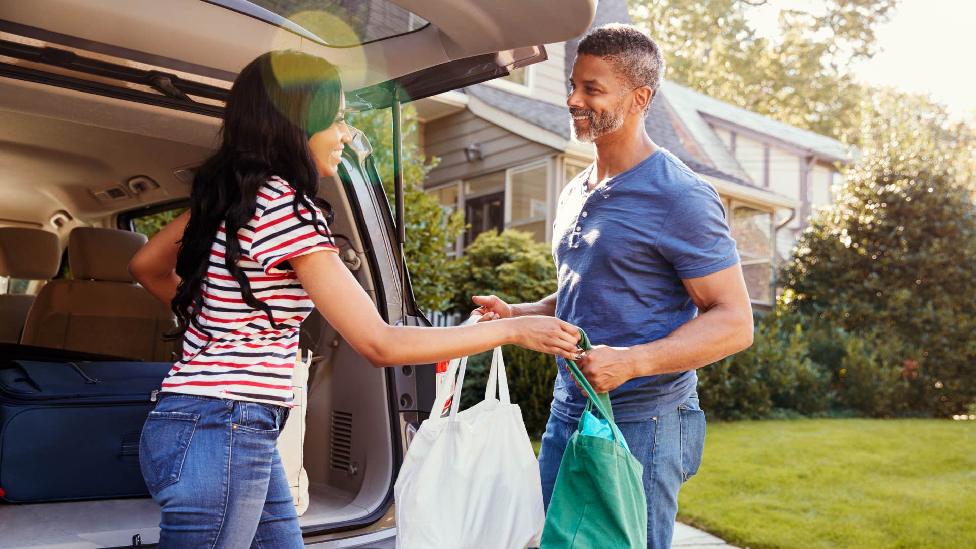 Chivalrous man helps woman with bags