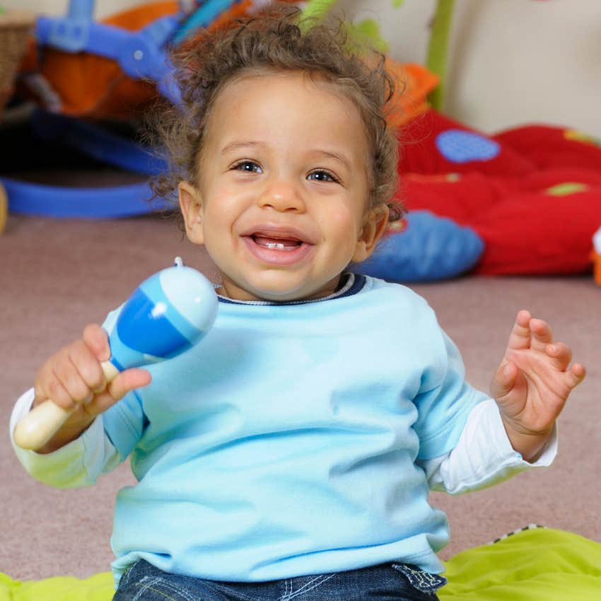 baby playing with musical instrument only takes babies two days to learn rhythm but not melody