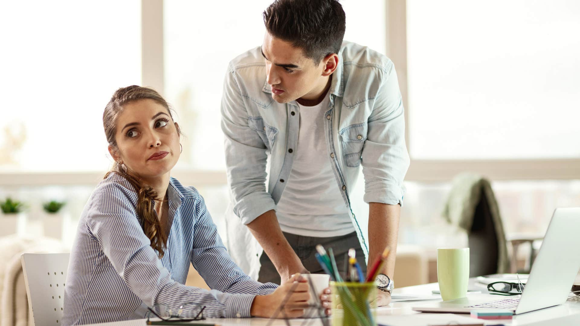 businessman saying he doesn't like how his colleague handled that