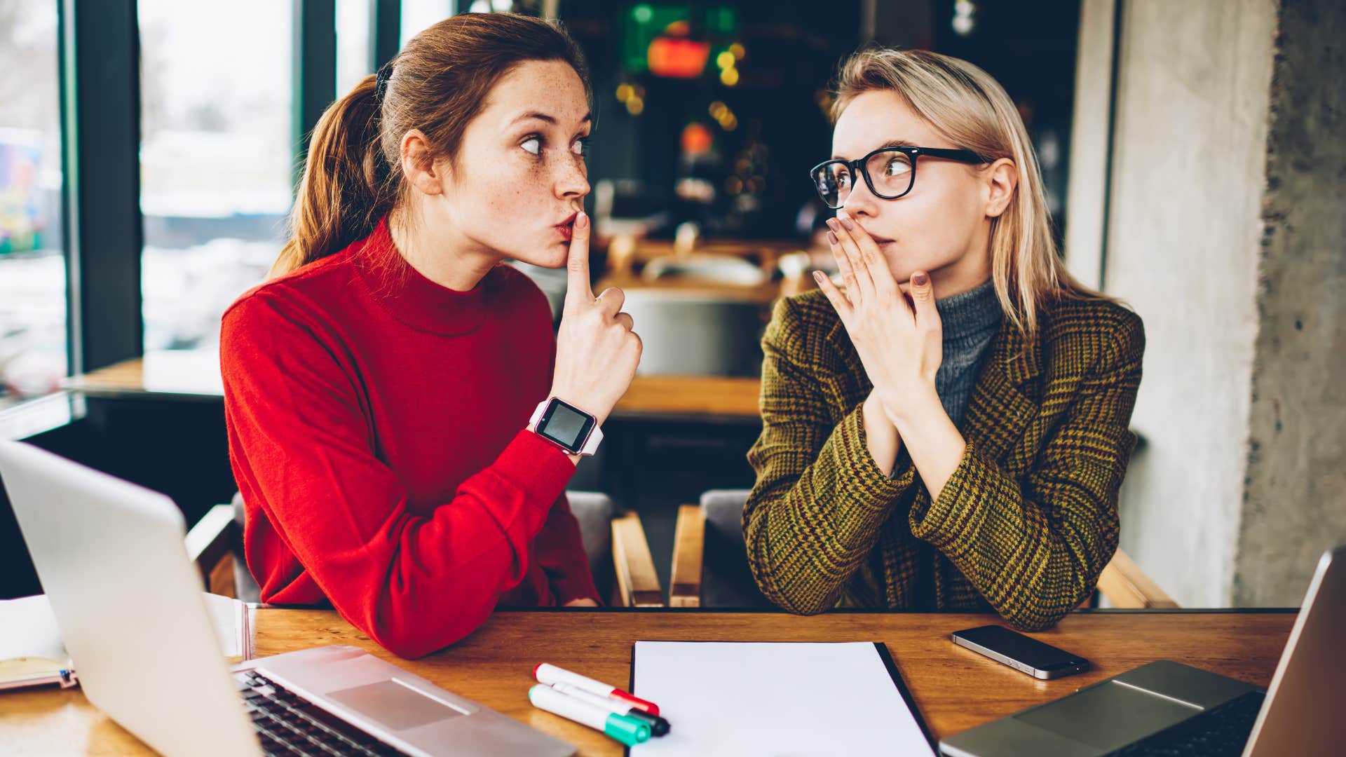 woman telling her friend to give other people the chance to talk