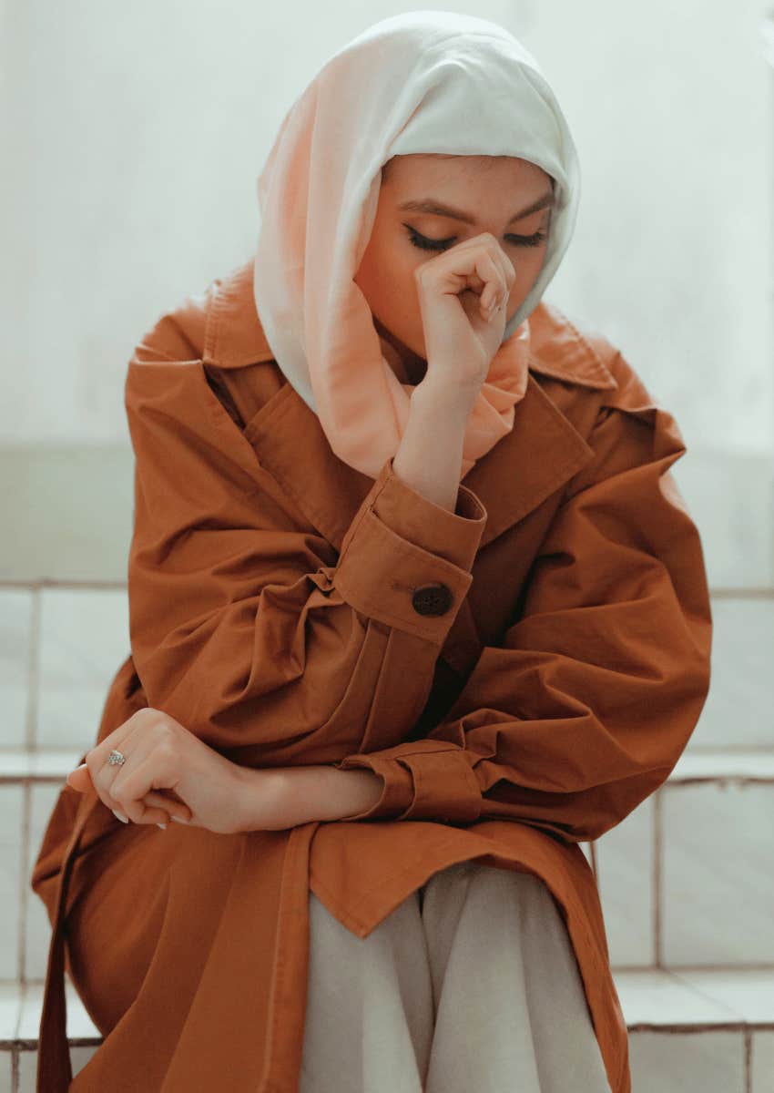 pensive woman looking down