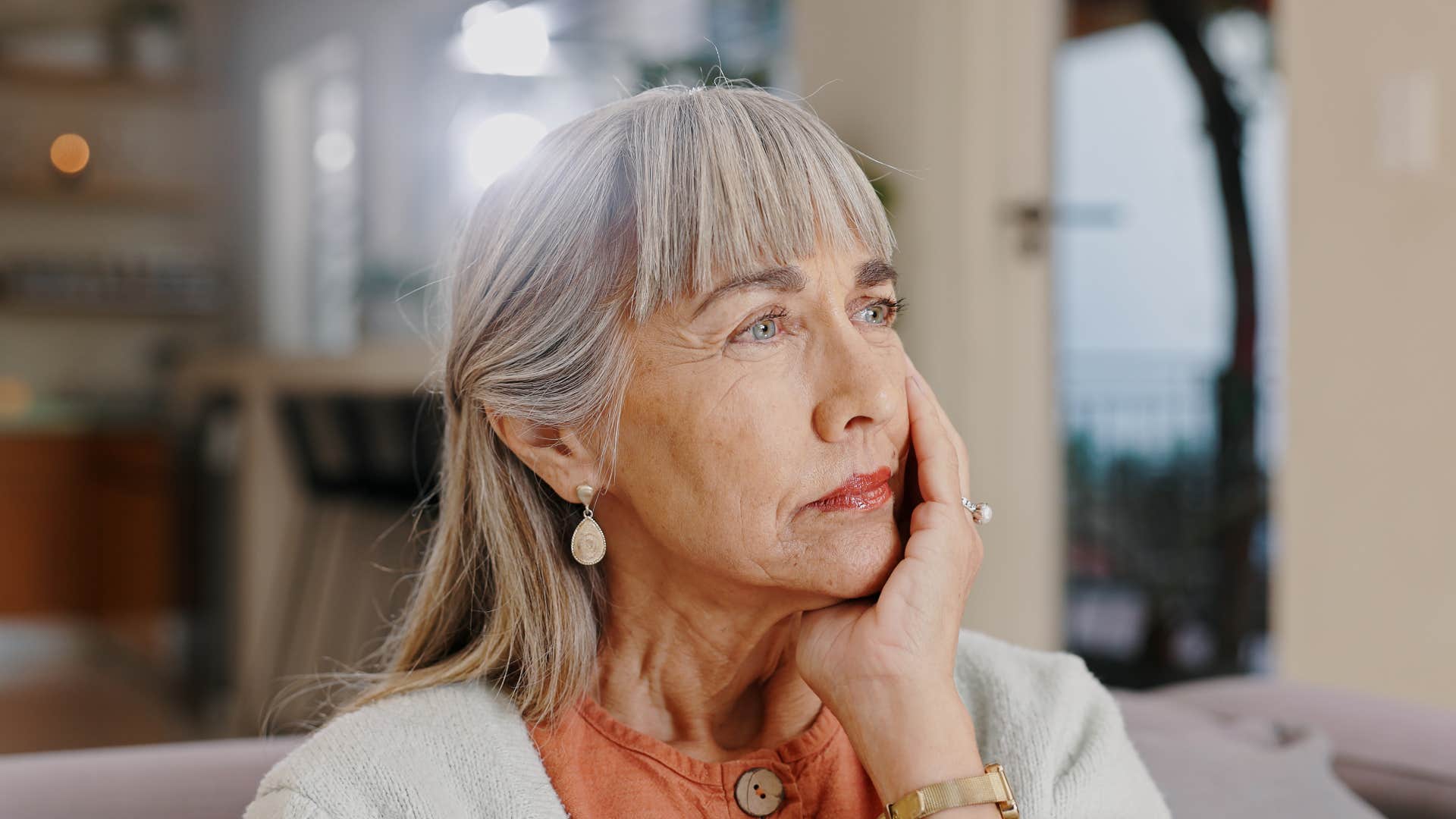 highly intelligent woman sitting at home thinking before she speaks