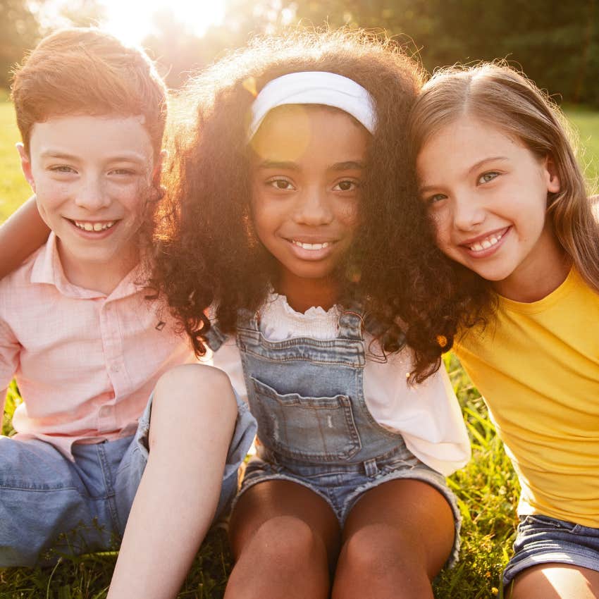 Social kids smiling and hugging together