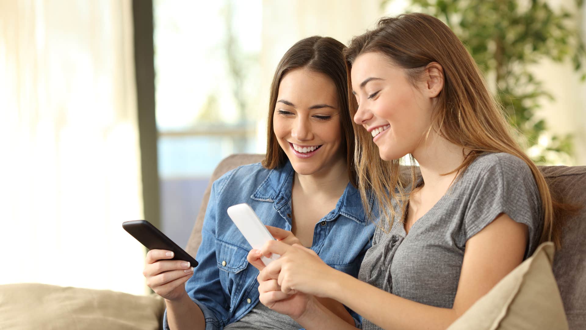 women looking at their phones talking asking did you see what i sent you