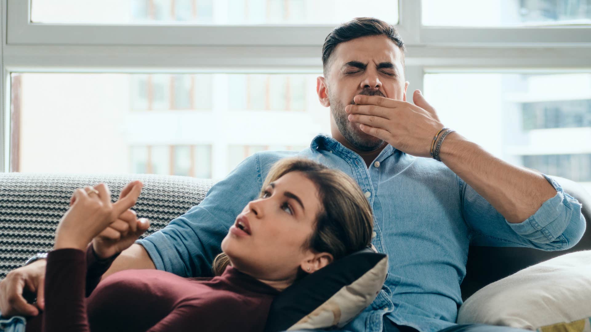 man yawning during conversation saying i was listening 
