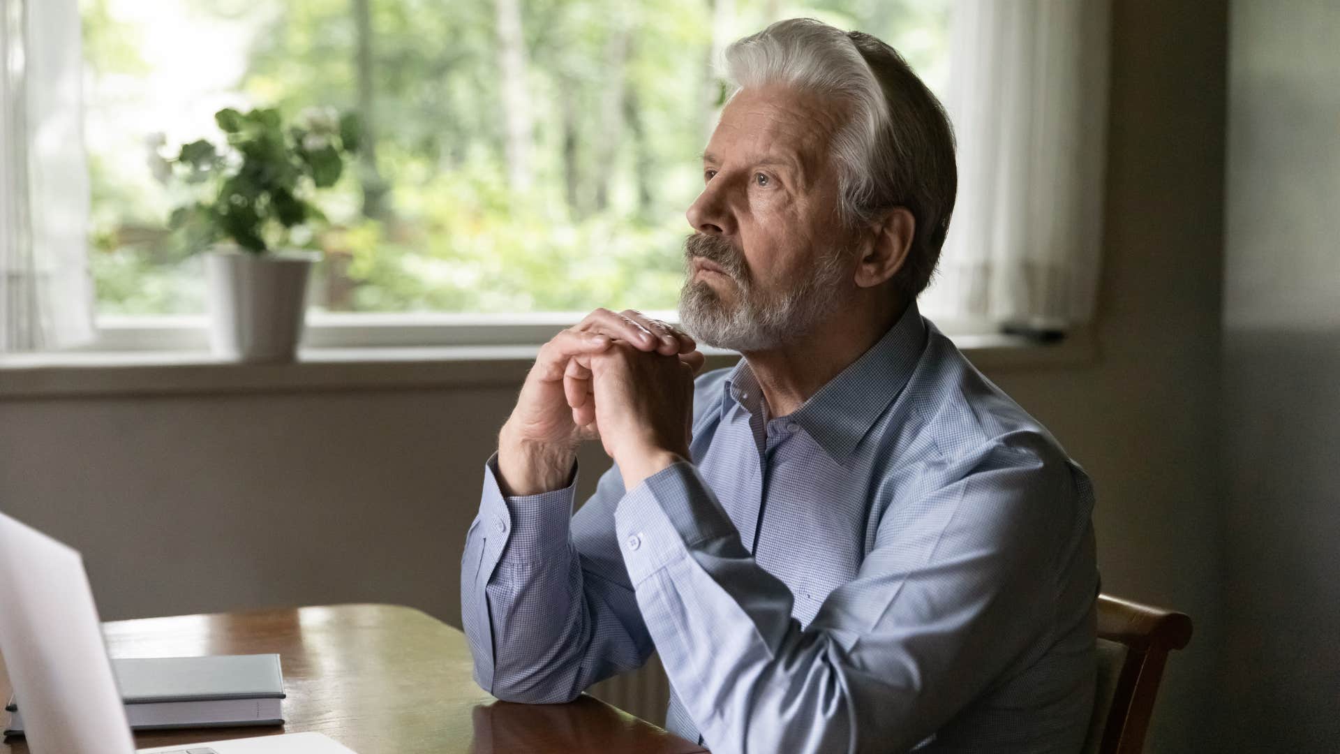 reflective man who feels less motivated when it's cold outside