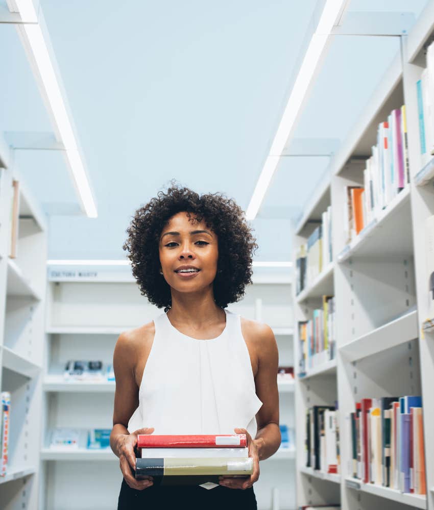 Passionate person with books showing way to be ok despite chaos