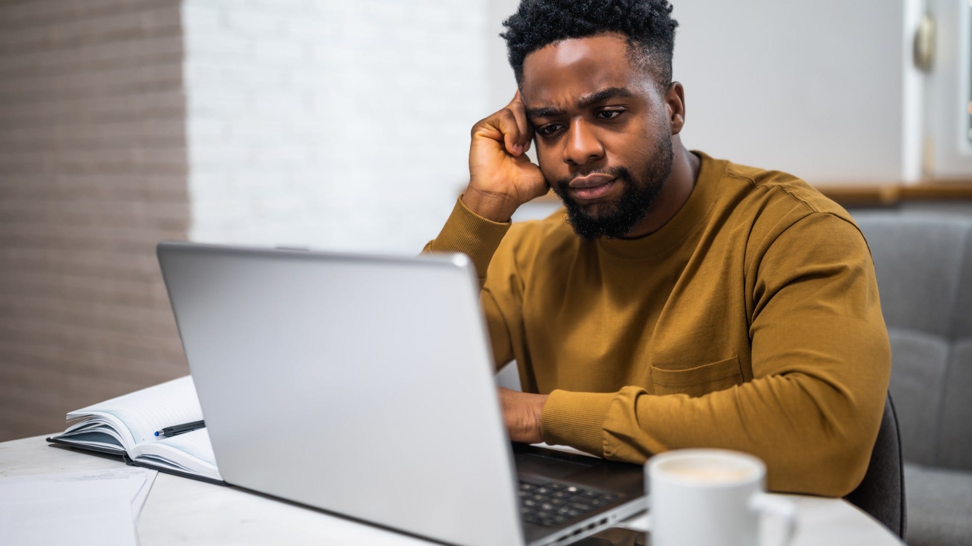 man who grew up in a financially unstable home downplaying financial success