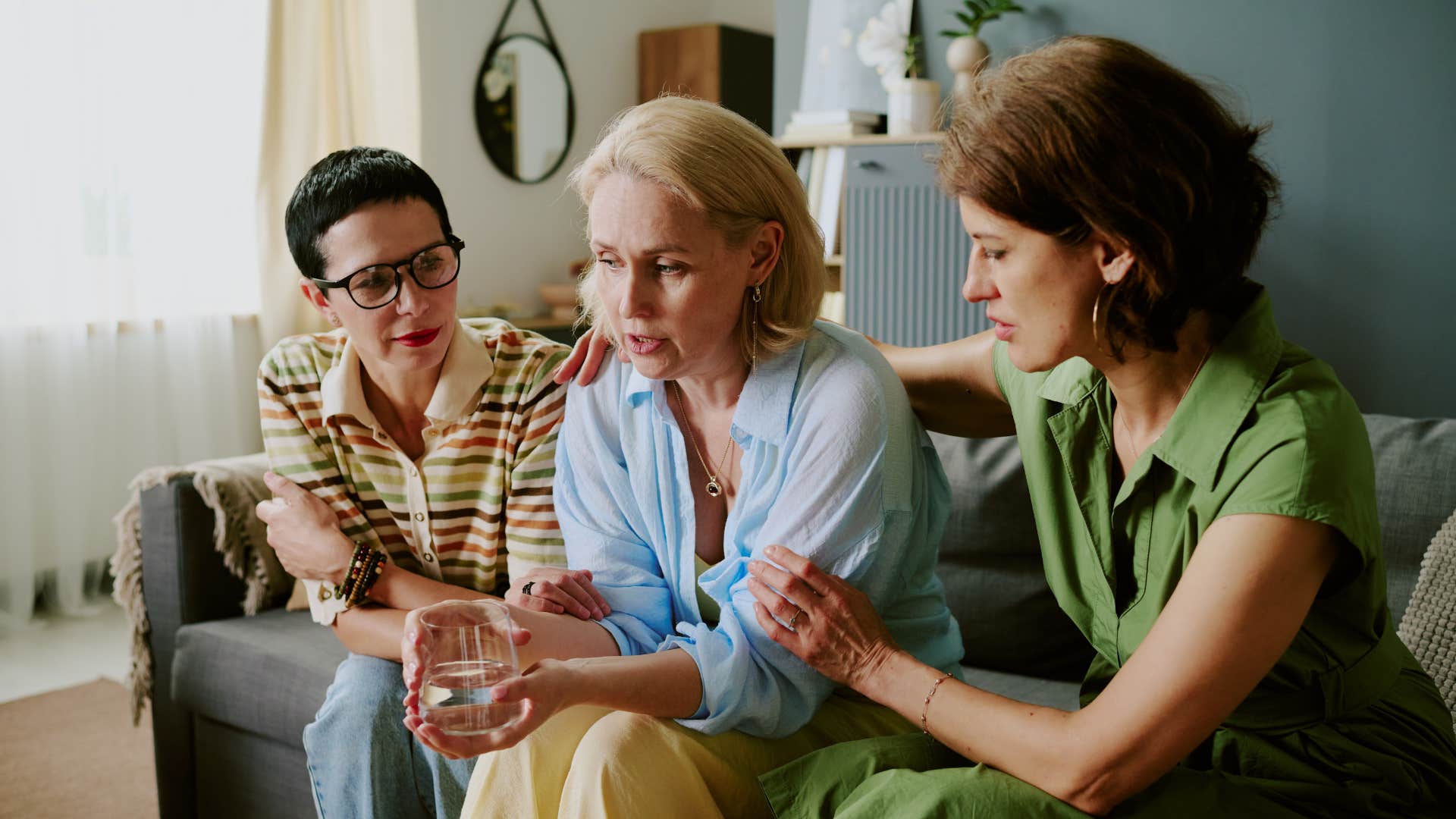 woman who hates being the center of attention sitting with friends