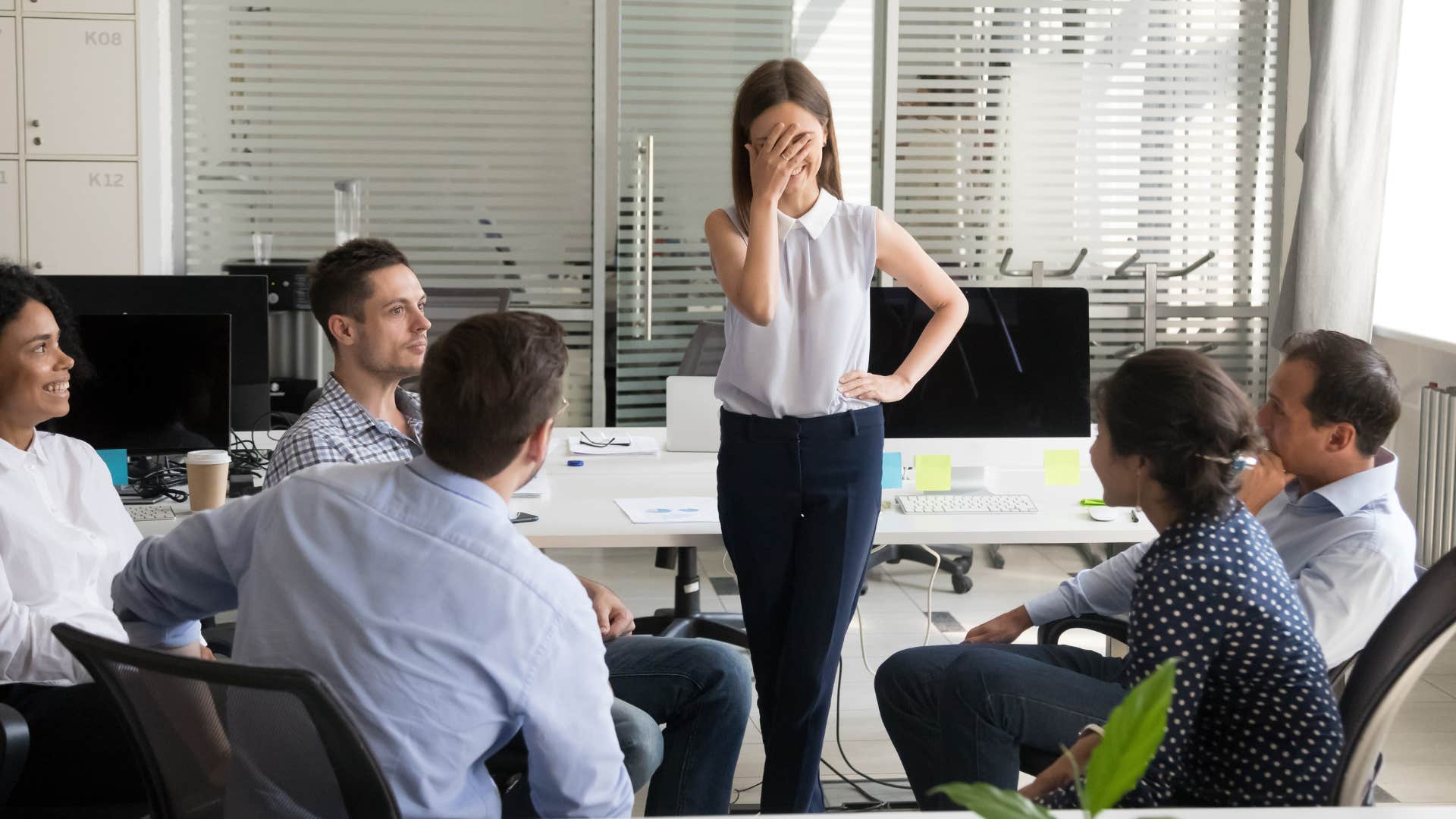 shy professional woman worrying about how she's perceived in front of colleagues