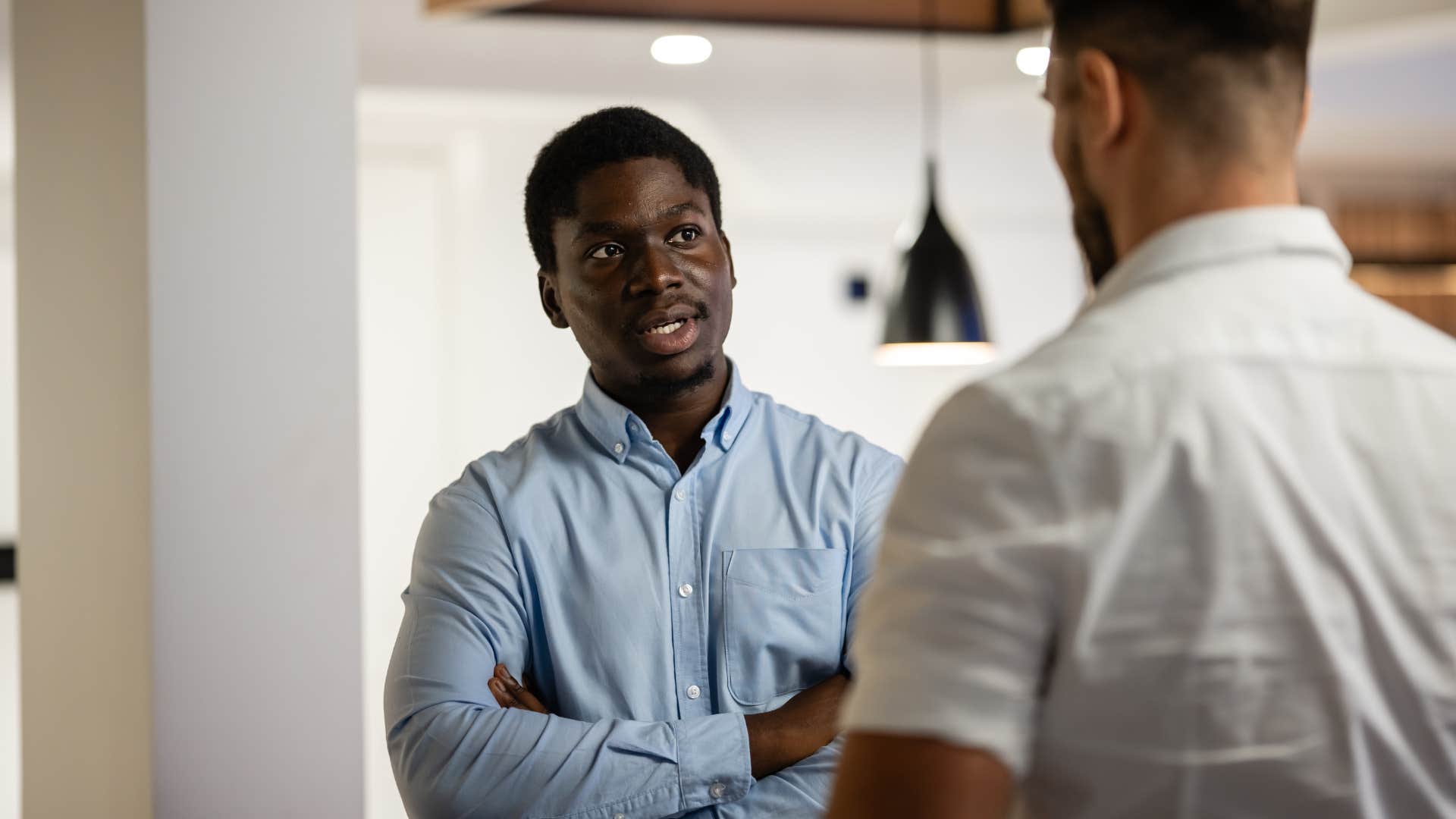 man who doesn't try to impress anyone saying you don't have to explain as he crosses arms
