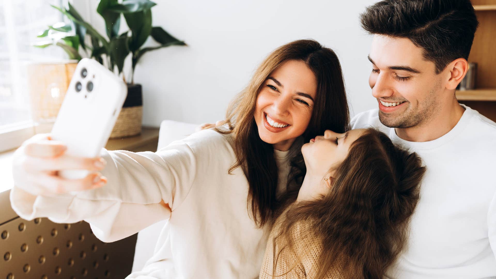 Woman documenting everything online with her family.