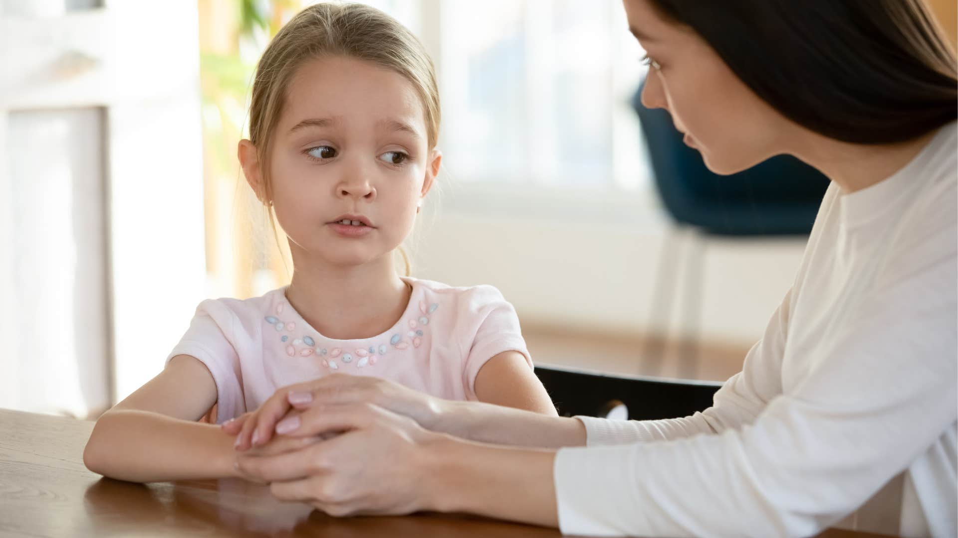 Woman stepping in to prevent failure in her daughter.