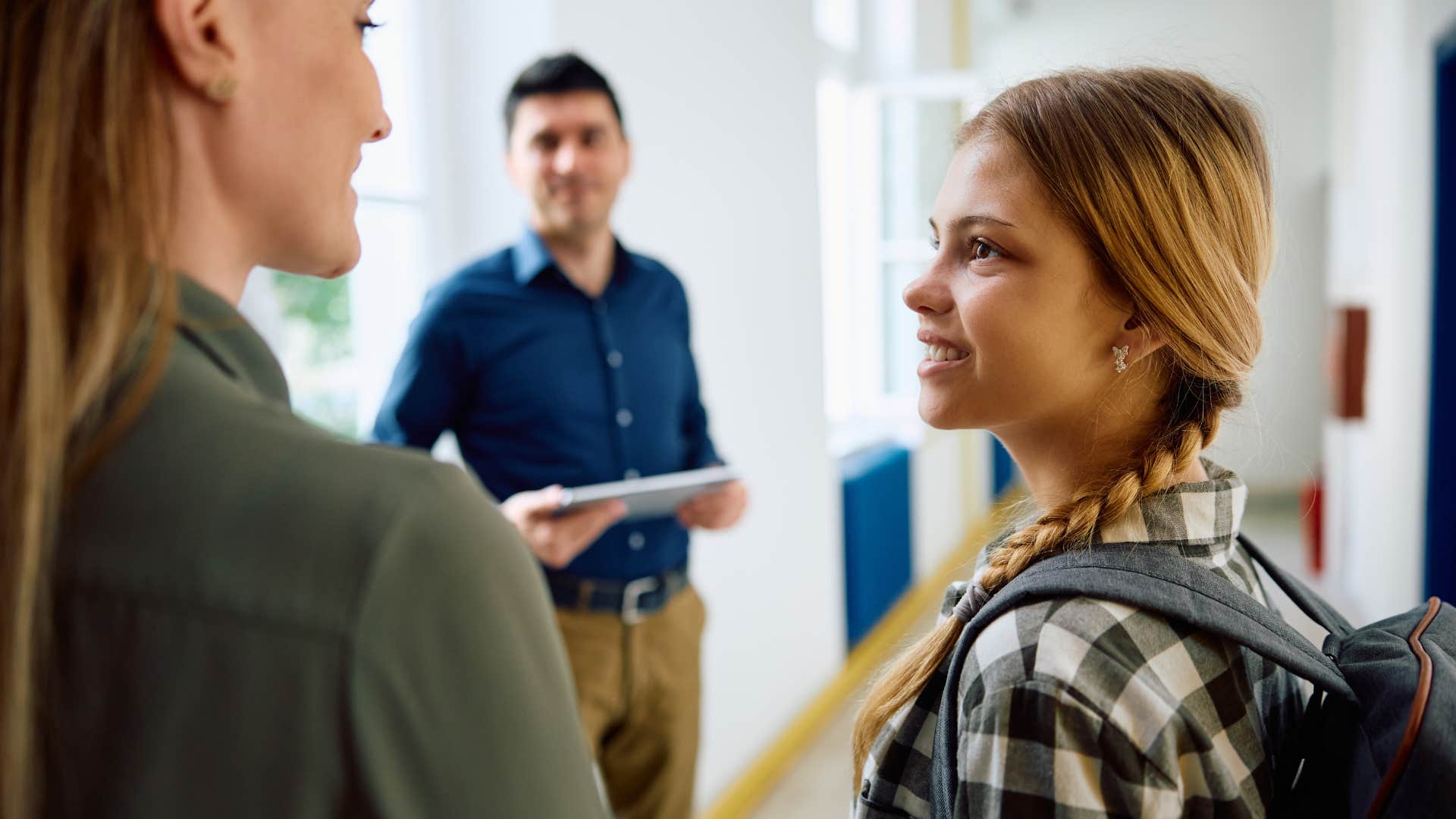 Mother stepping in to resolve conflicts with teachers at school.