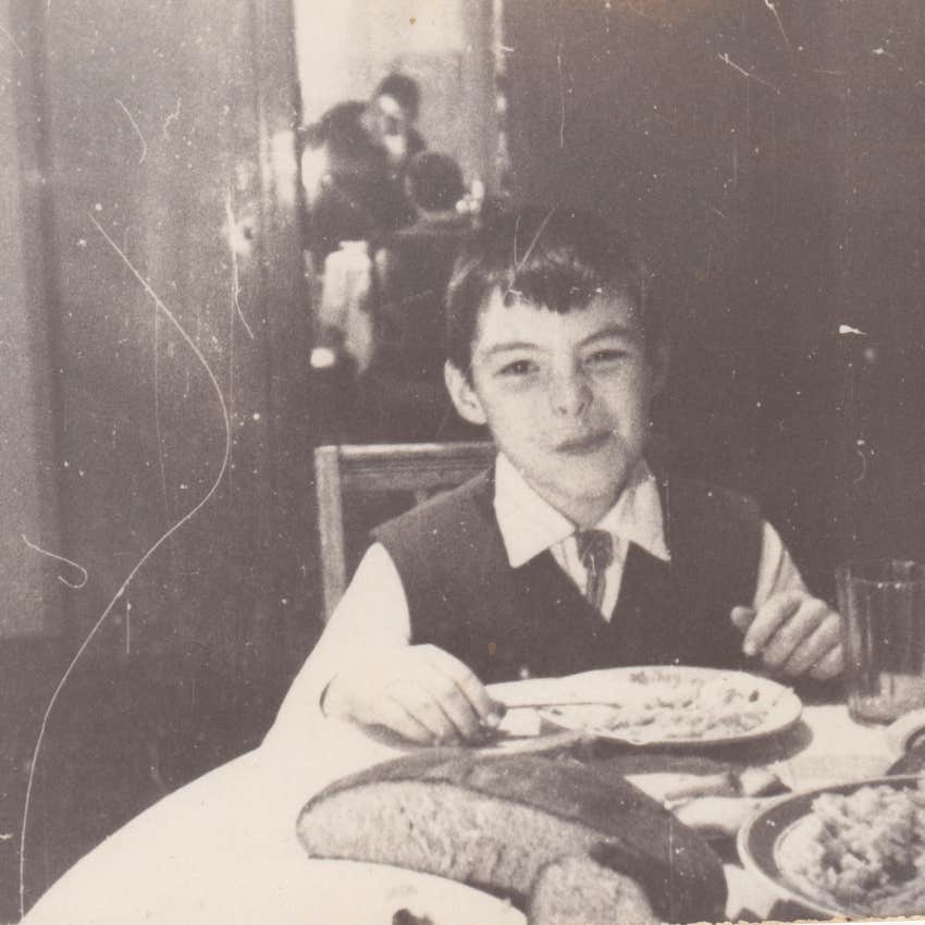 Little boy who knows that family dinners are nonnegotiable eating